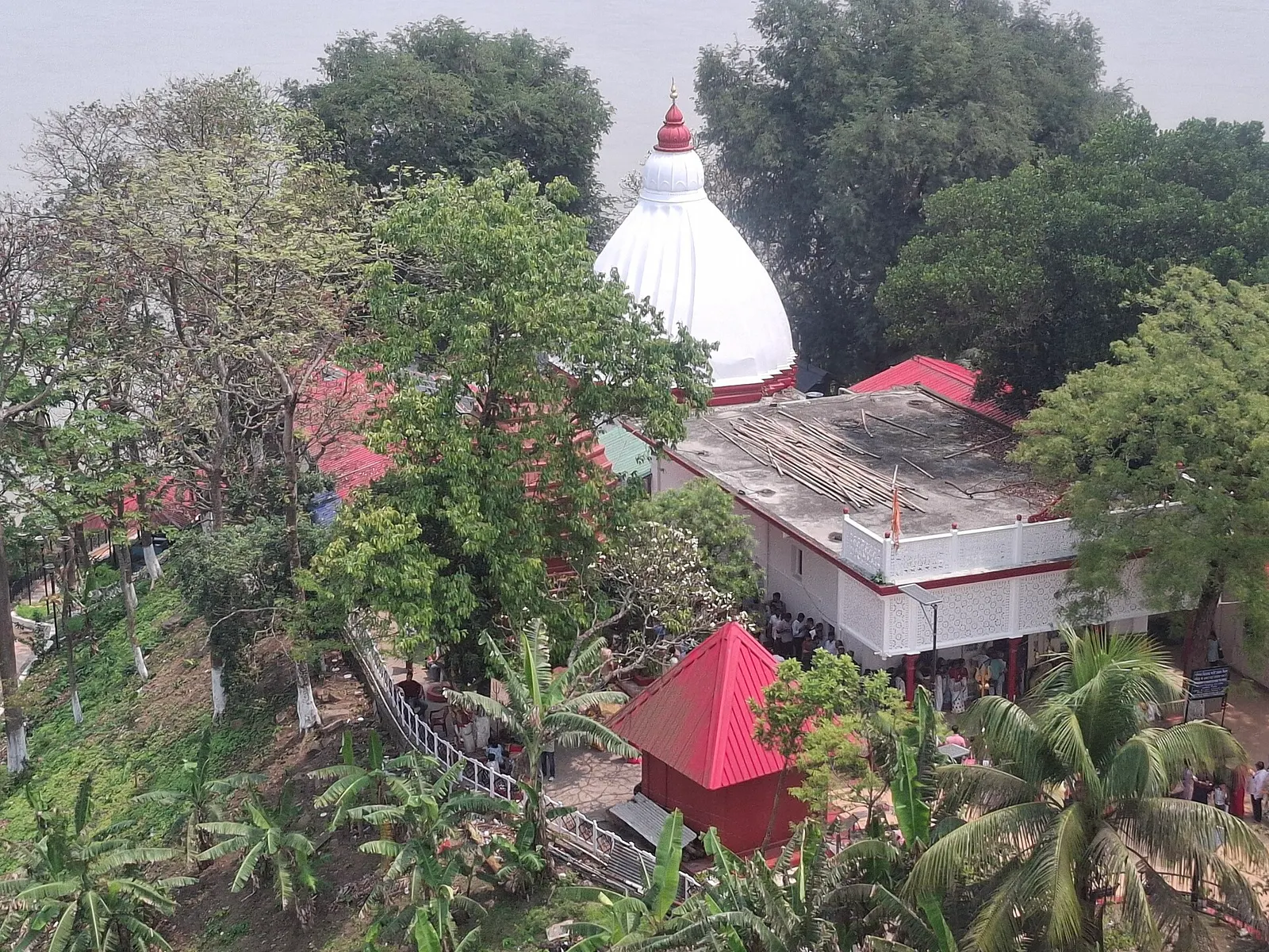 Umananda Temple among trees on Peacock Island in the Brahmaputra